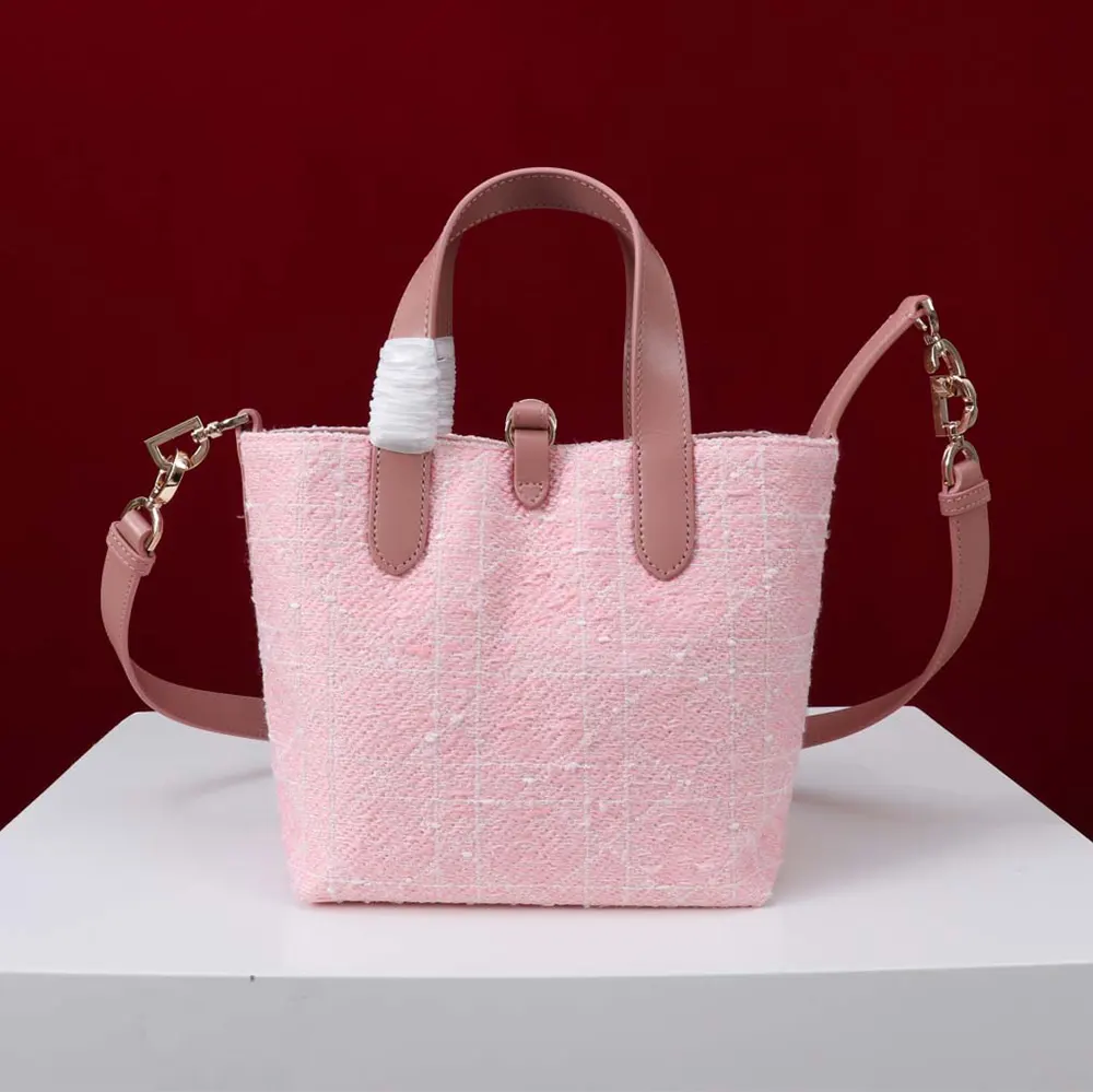 Side angle showing silver hardware on Dior Women Small Dior Toujours Tote
