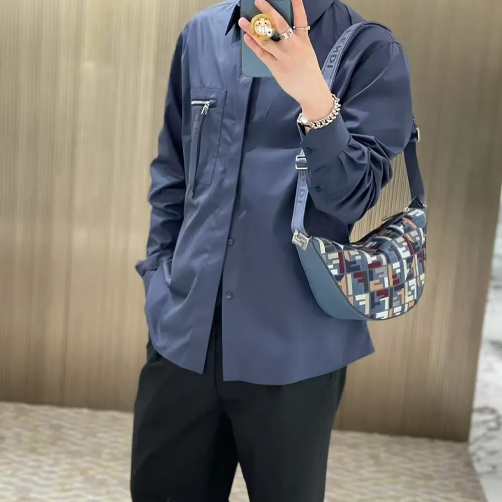 Side angle showing compact silhouette of Fendi Men Roma Leather Fendi Melon Small Fabric Blue