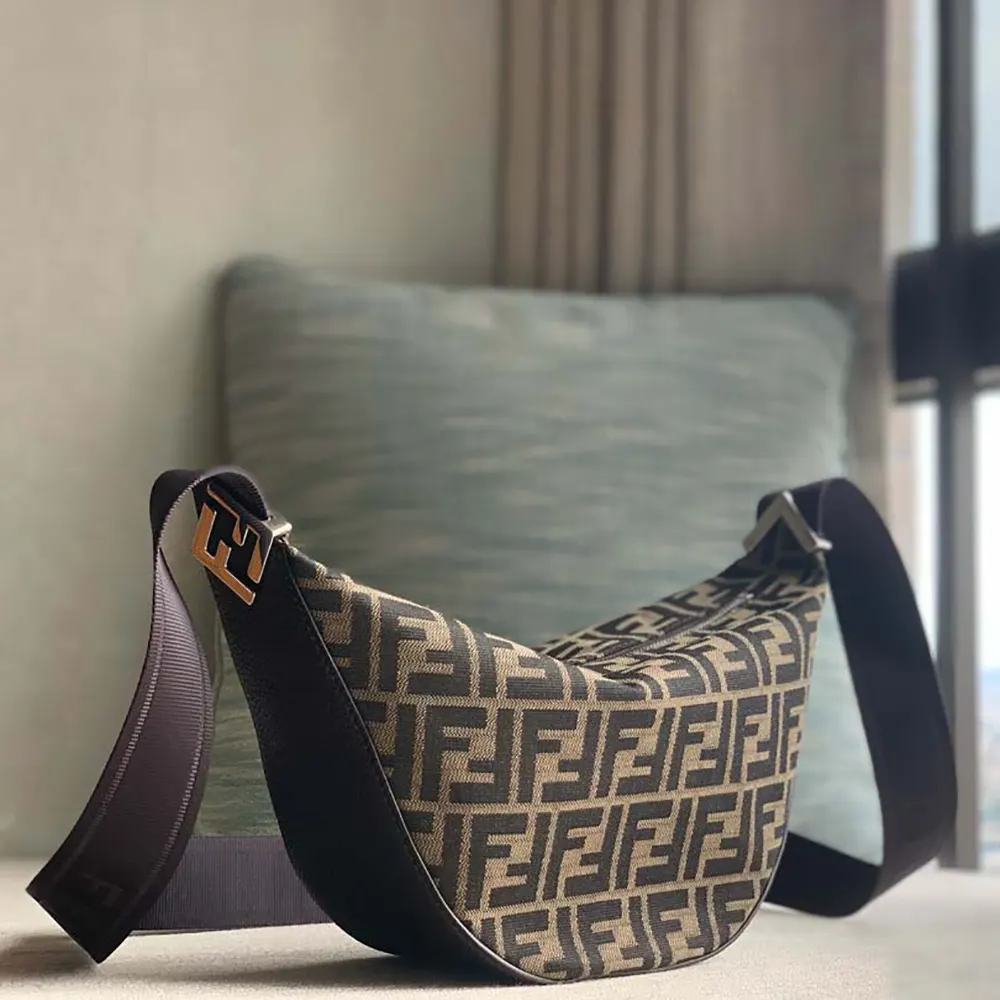 Side angle showing compact shape of Fendi Unisex FF Jacquard Fendi Melon Small FF Bag