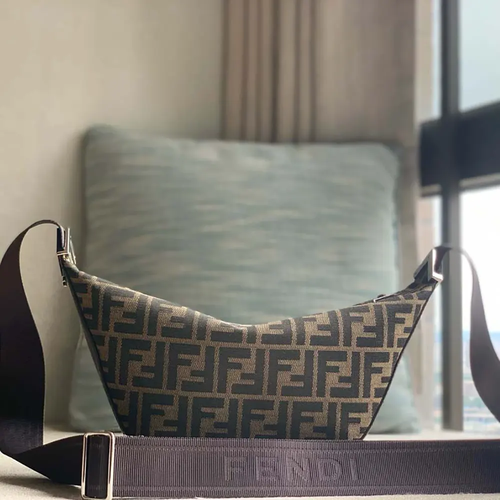 Close-up of gold double FF logo closure on Fendi Unisex FF Jacquard Fendi Melon Small FF Bag