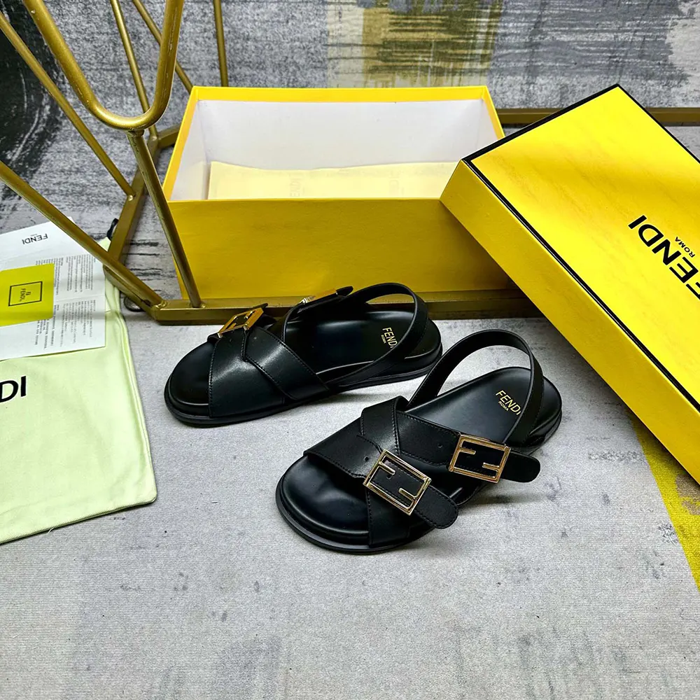 Top-down angle of Fendi Women Feel Black Leather Slides on foot