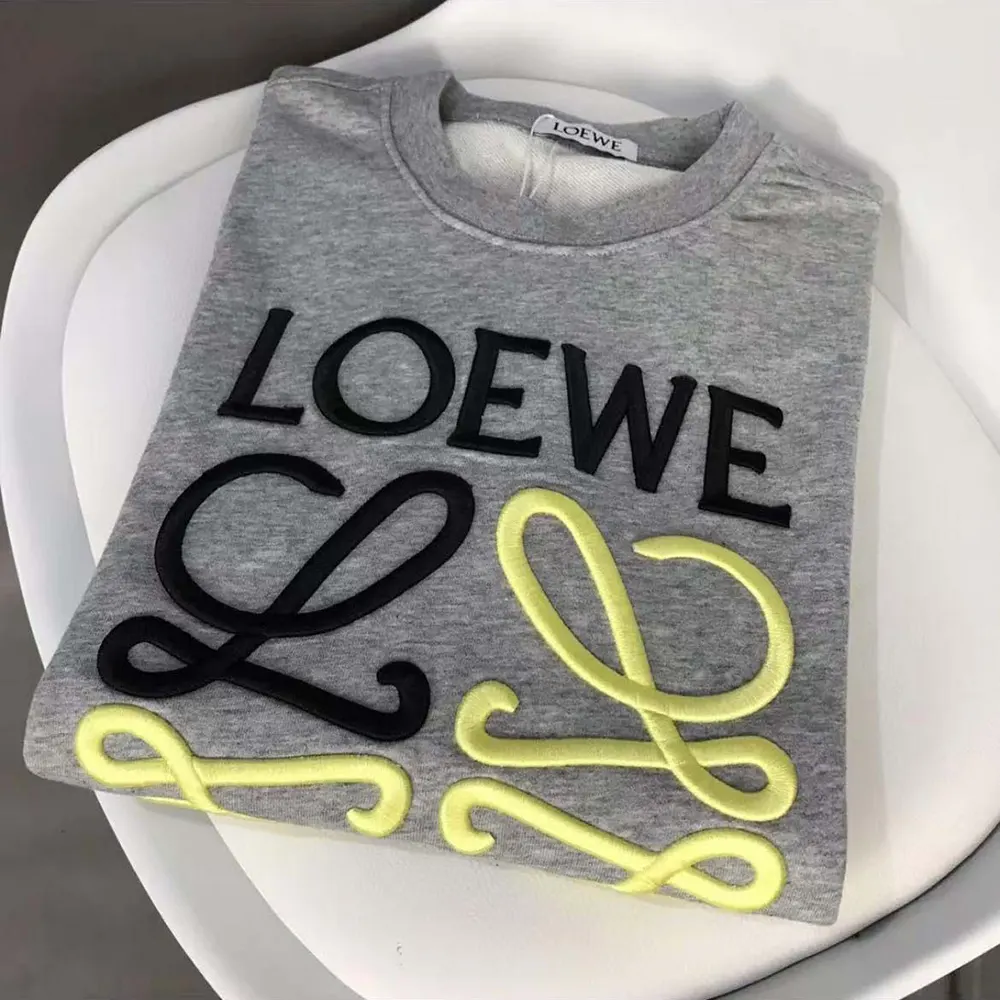 Side angle showing fit and ribbed cuffs on Loewe Men Anagram sweatshirt