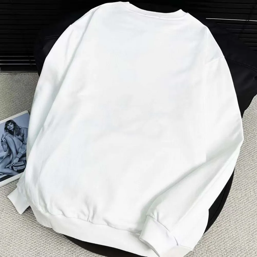 Side angle showing ribbed cuffs and fit of Loewe Men Anagram sweatshirt
