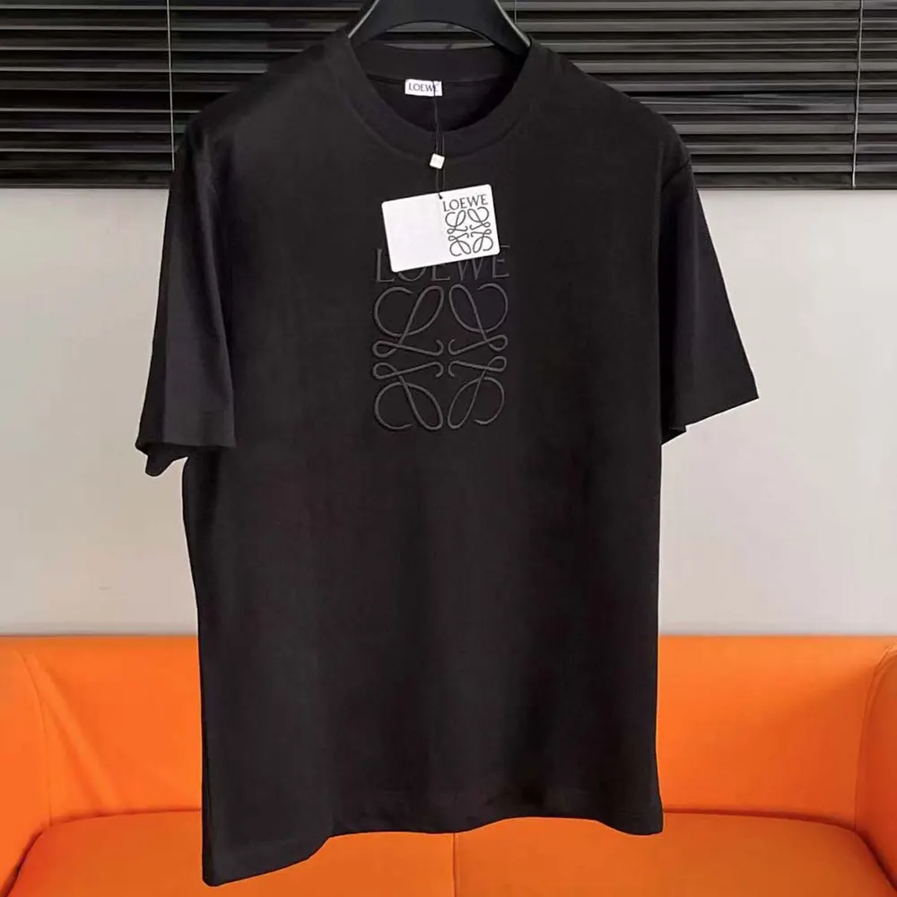 Close-up of Loewe logo embroidery on black oversize fit t-shirt