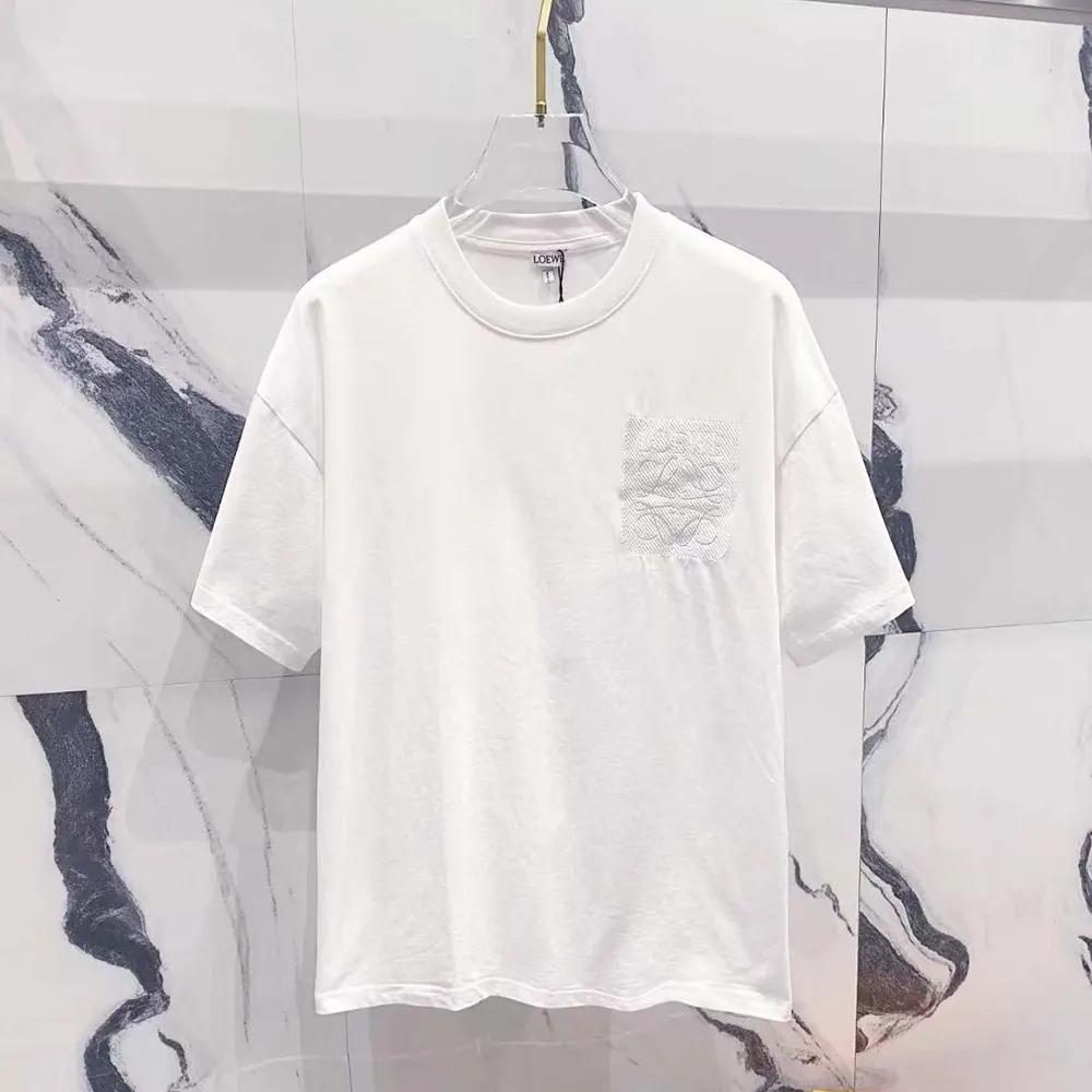 Close-up of Loewe embossed logo on white cotton T-shirt