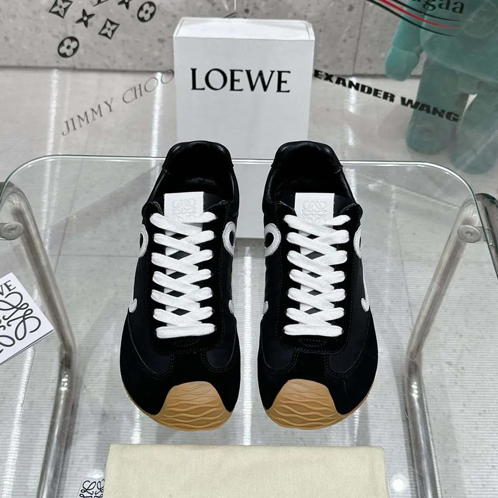 Close-up of black calfskin overlays and lace-up details on Loewe Ballet Runner 2.0