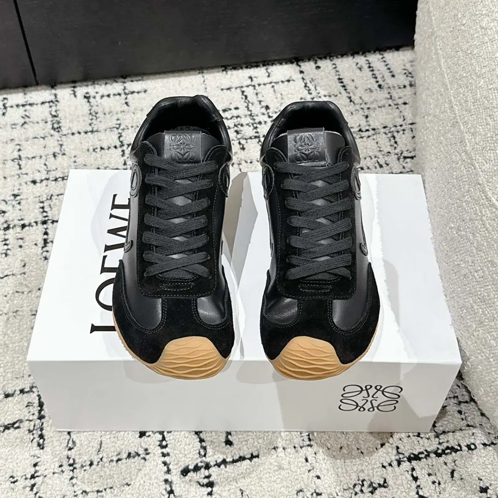 Close-up of lace-up closure and embossed Loewe logo on ballet runner