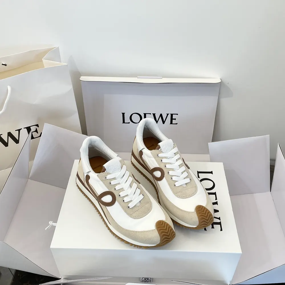 Close-up on lace-up and embossed Loewe logo hardware on Flow Runner