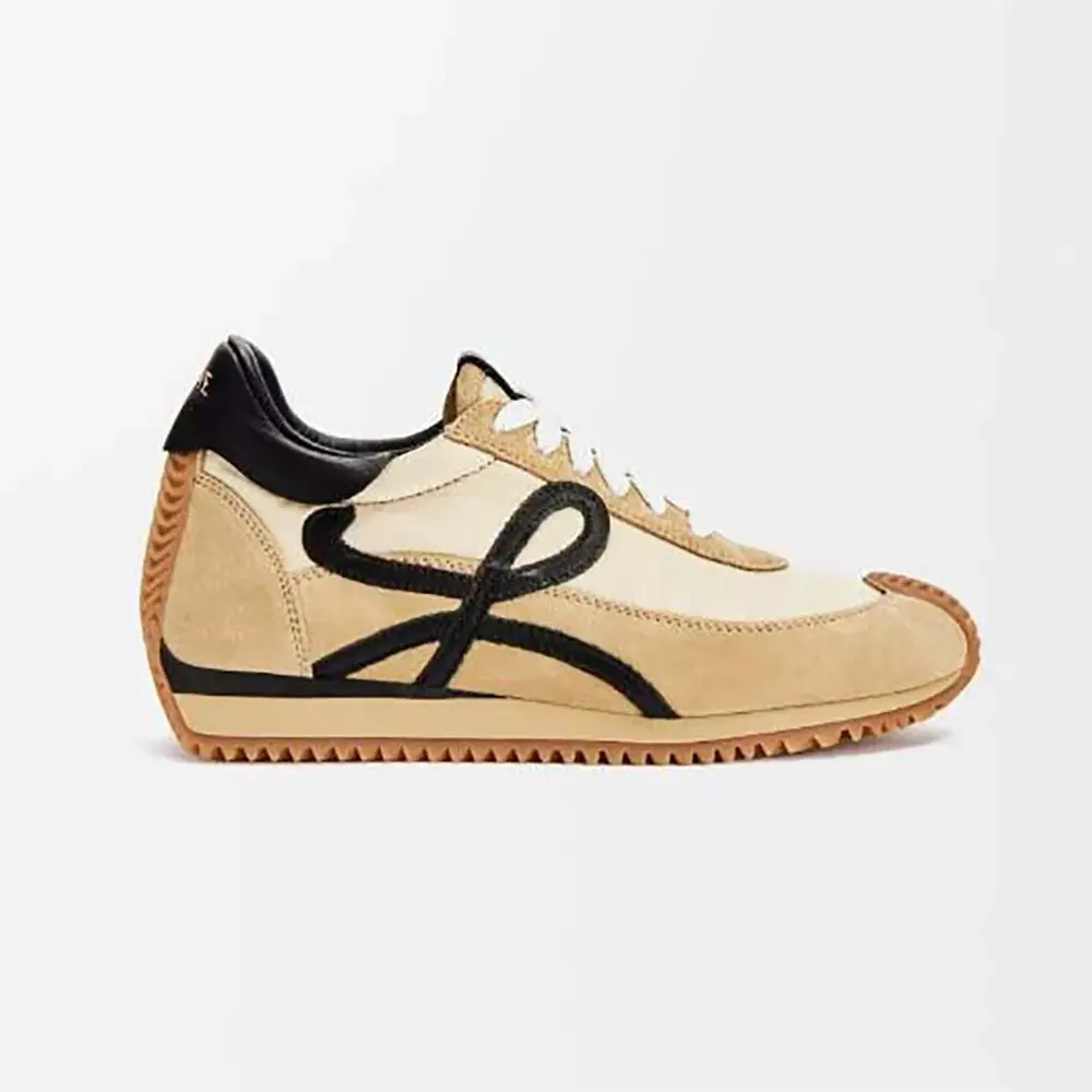 Side profile of Loewe Unisex Flow Runner in gold and black