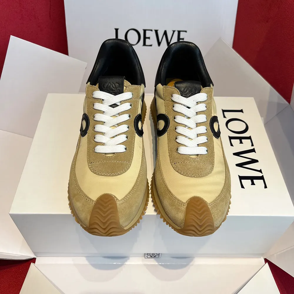 Close-up on gold suede detailing and leather Loewe logo