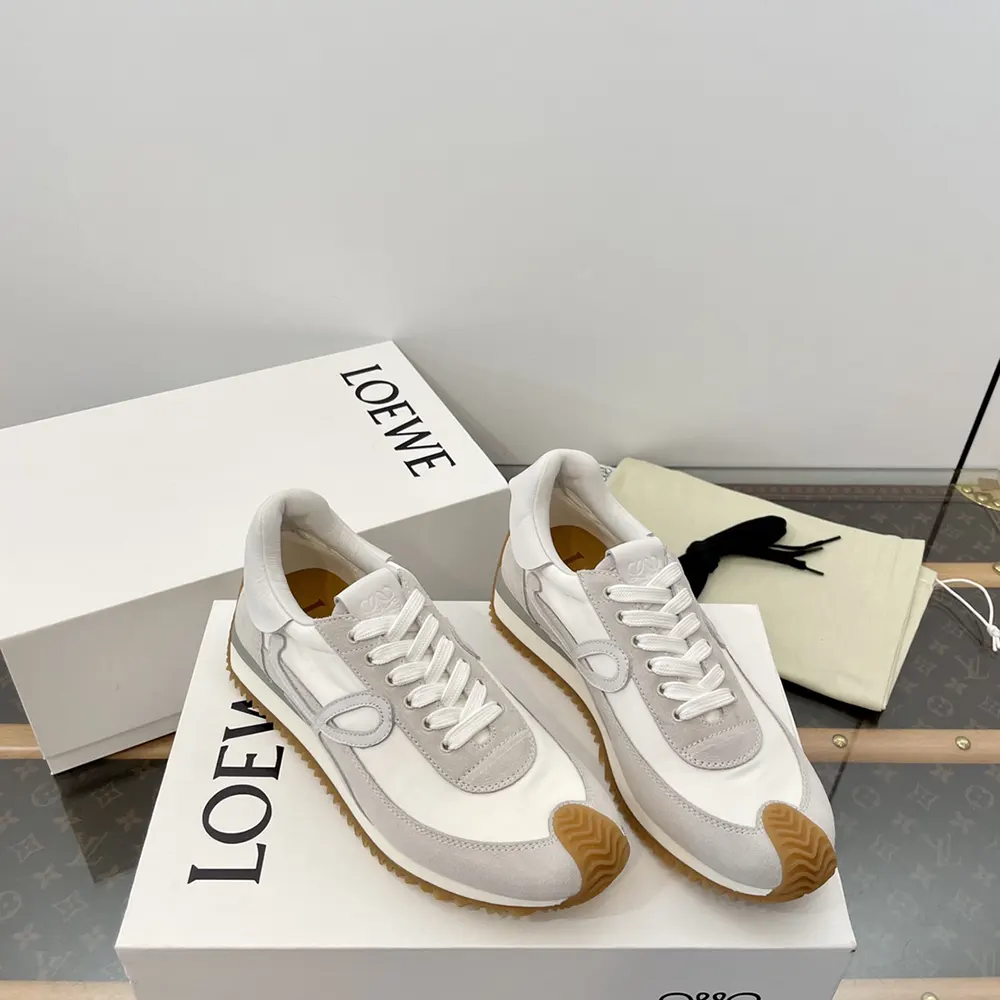 Close-up of signature Loewe branded hardware on white Flow Runner