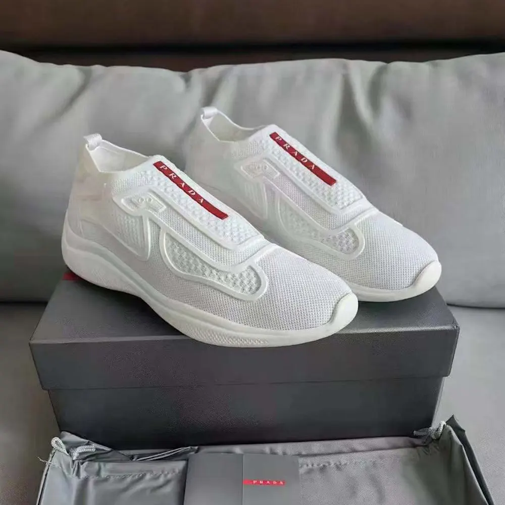 Close-up on knit fabric and slip-on detail of Prada Men Americas Cup Knit Slip-On-White