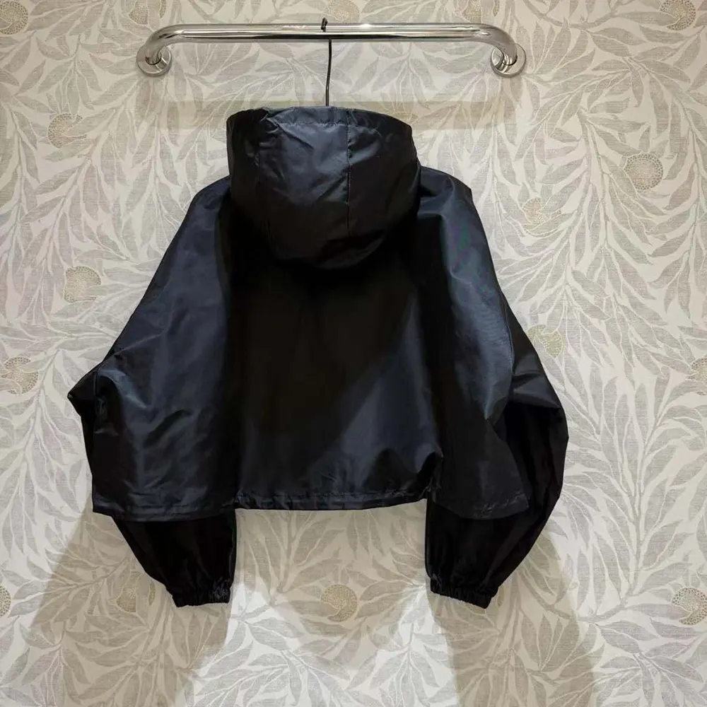 Side profile showing silhouette of Prada Women Re-Nylon Cropped Jacket-Black
