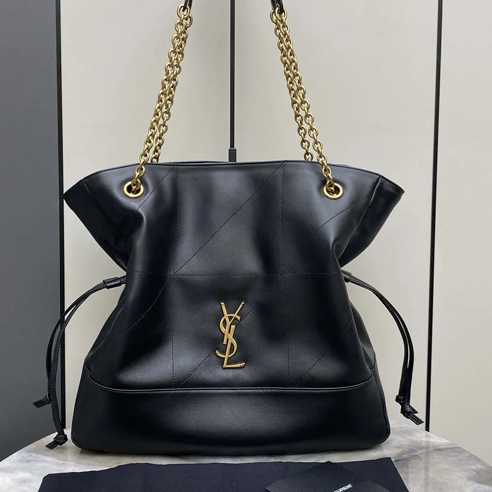 Close-up of Saint Laurent YSL logo hardware on black lambskin bag