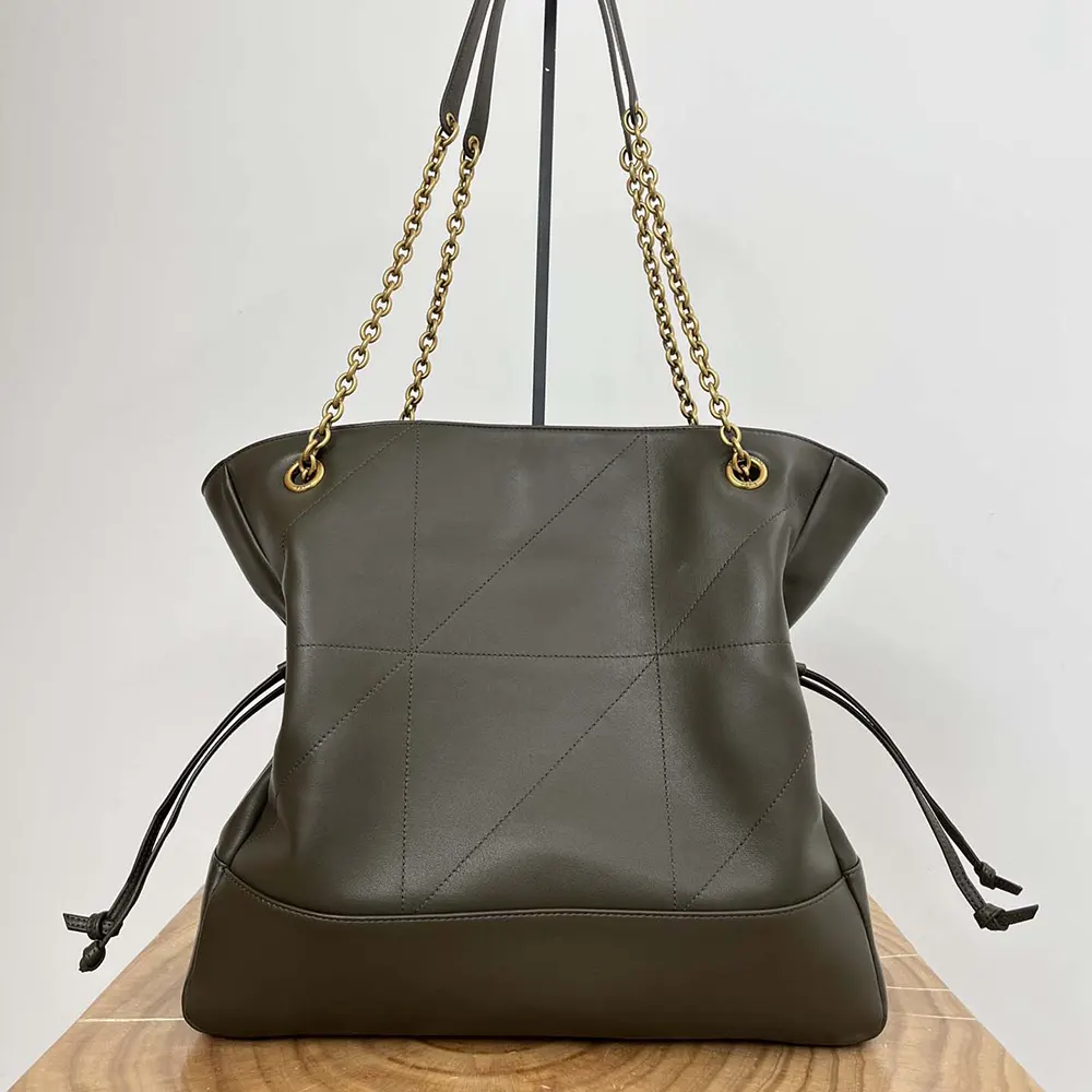 Side angle showing magnetic closure on Saint Laurent YSL Jamie Shopping bag