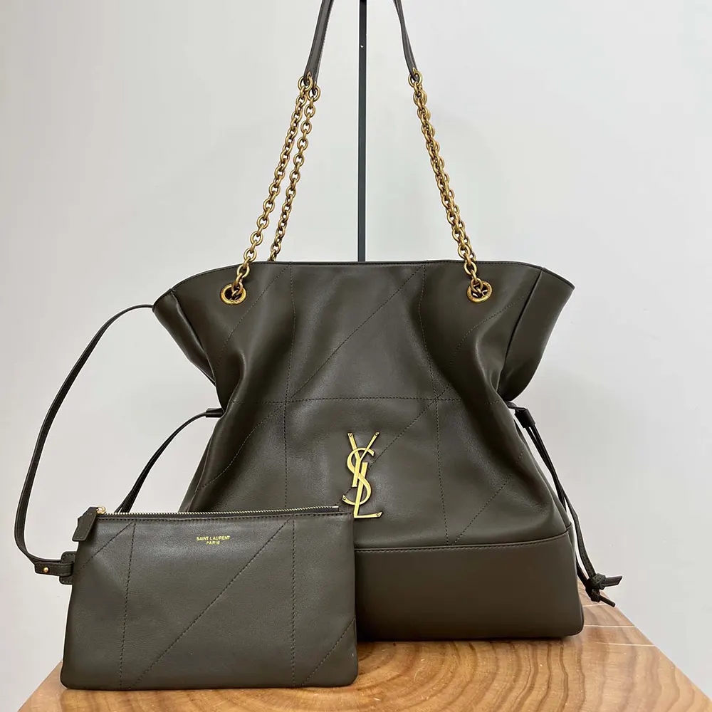Close-up of gold YSL hardware on Jamie Shopping bag in dark green