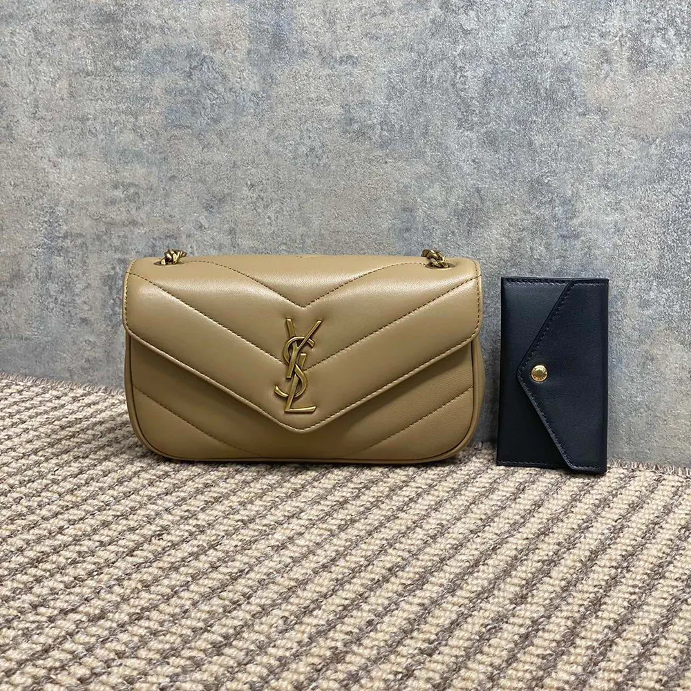 Close-up of YSL gold monogram hardware on Loulou Mini Lambskin bag