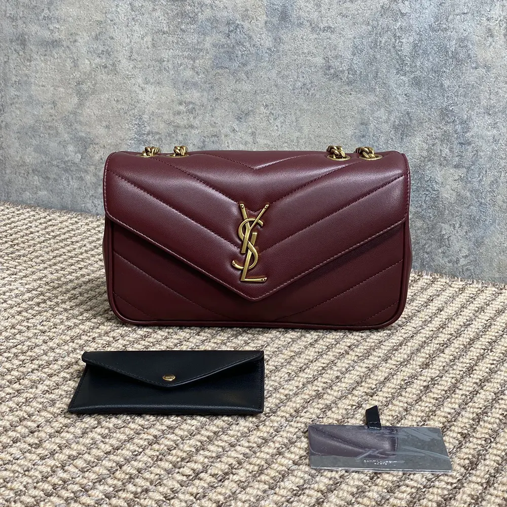 Close-up of gold-tone YSL logo hardware on Bordeaux Loulou Small bag