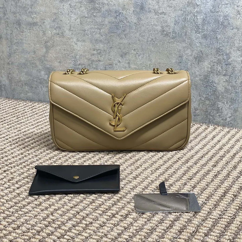 Close-up of gold YSL monogram on natural lambskin Loulou Small bag