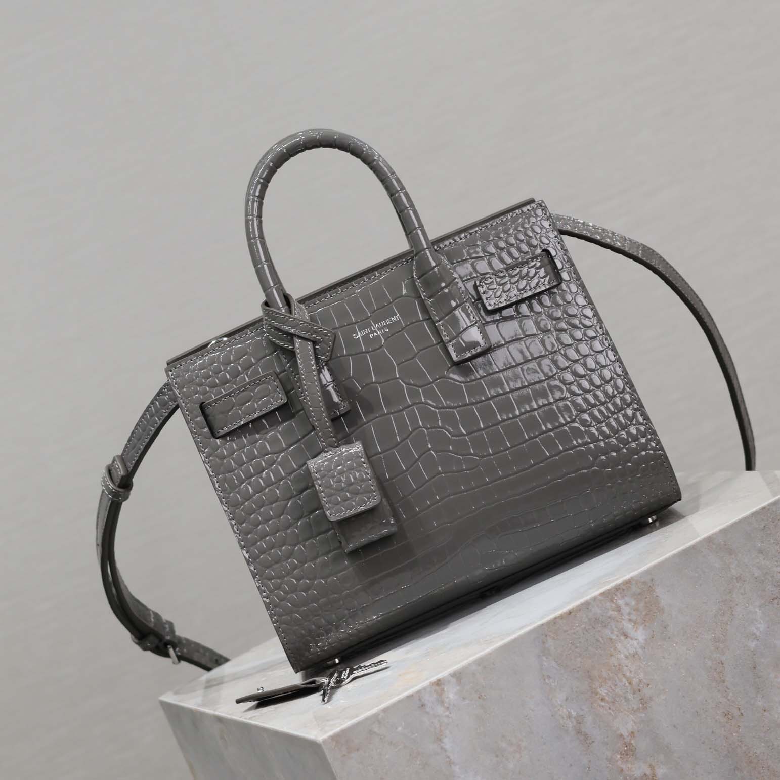 Side angle showing compact silhouette of Saint Laurent YSL Nano-Silver bag