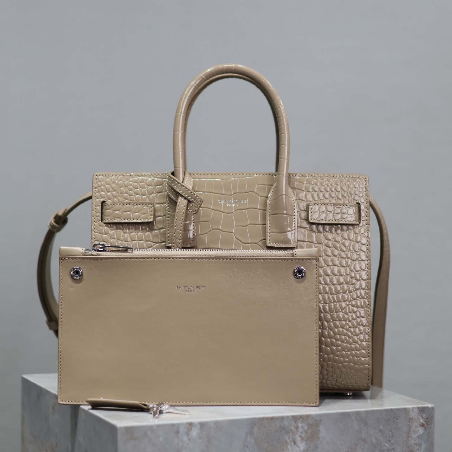 Close-up of gold-tone YSL hardware on Sac De Jour Baby-Sandy bag