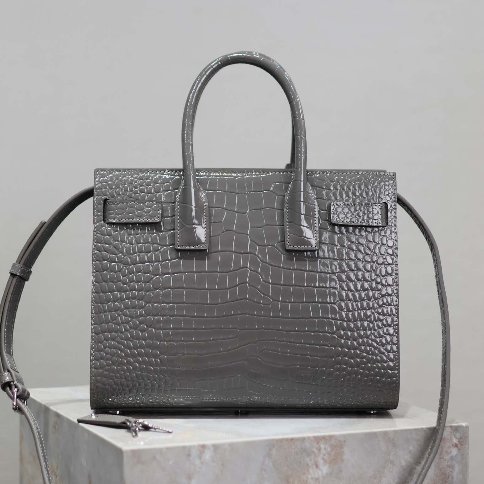 Side angle showing structured silhouette of Saint Laurent YSL Women Sac De Jour bag