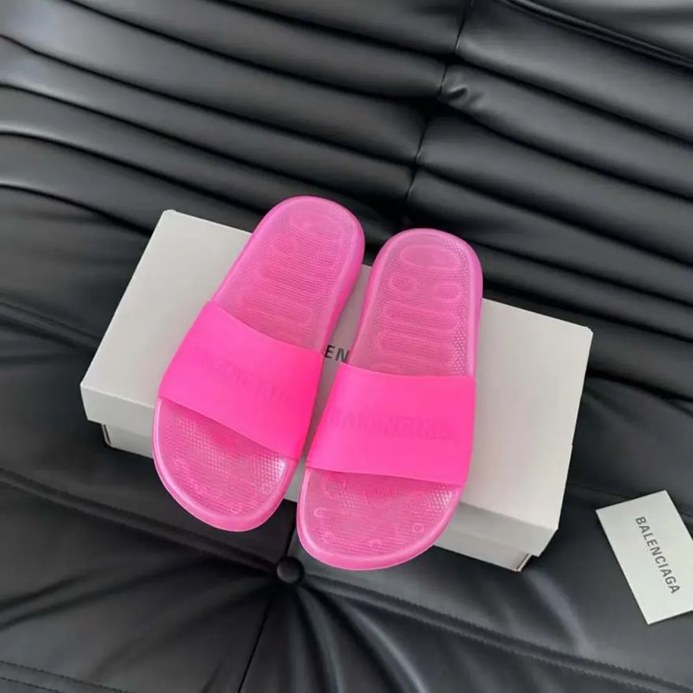 Top angle showing open toe and slip-on design of pink rubber slide sandal