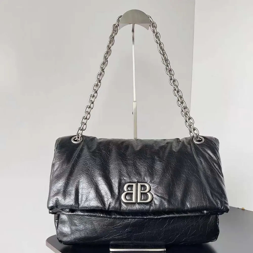 Side angle showing silhouette of Balenciaga Women Monaco Large Chain Bag