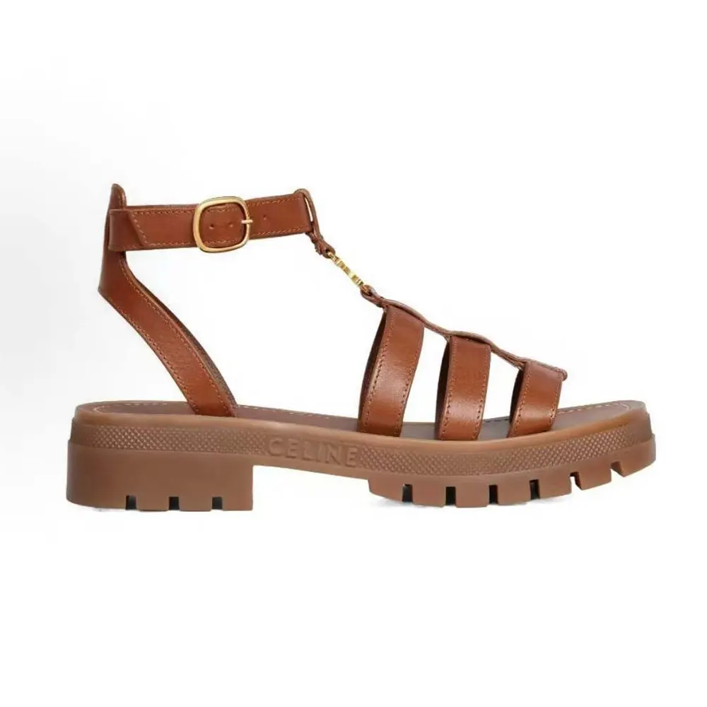 Side profile of Celine Women Clea Triomphe Gladiator Sandal in brown calfskin