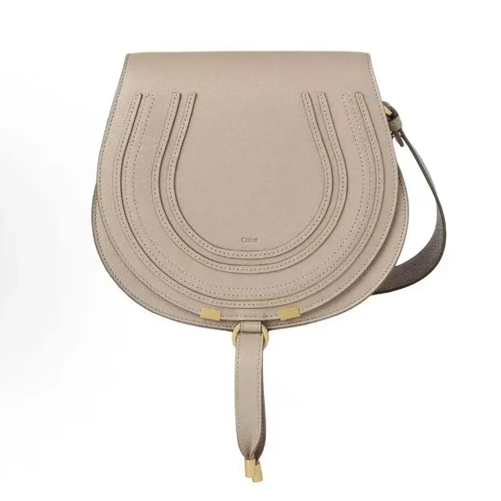 Front view of Chloe Women Marcie Small Saddle Bag-Sandy with braided detail