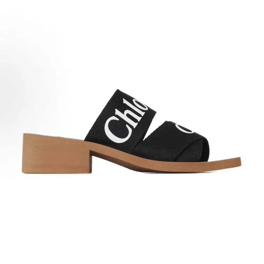 Side profile of Chloe Women Woody Heeled Mule-Black showing wooden heel