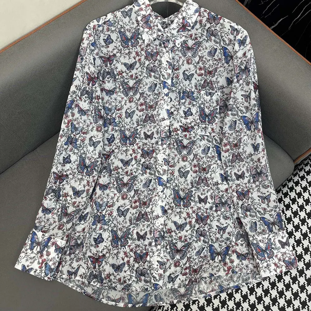Close-up detail of multicolor Toile de Jouy Papillon print on Dior blouse