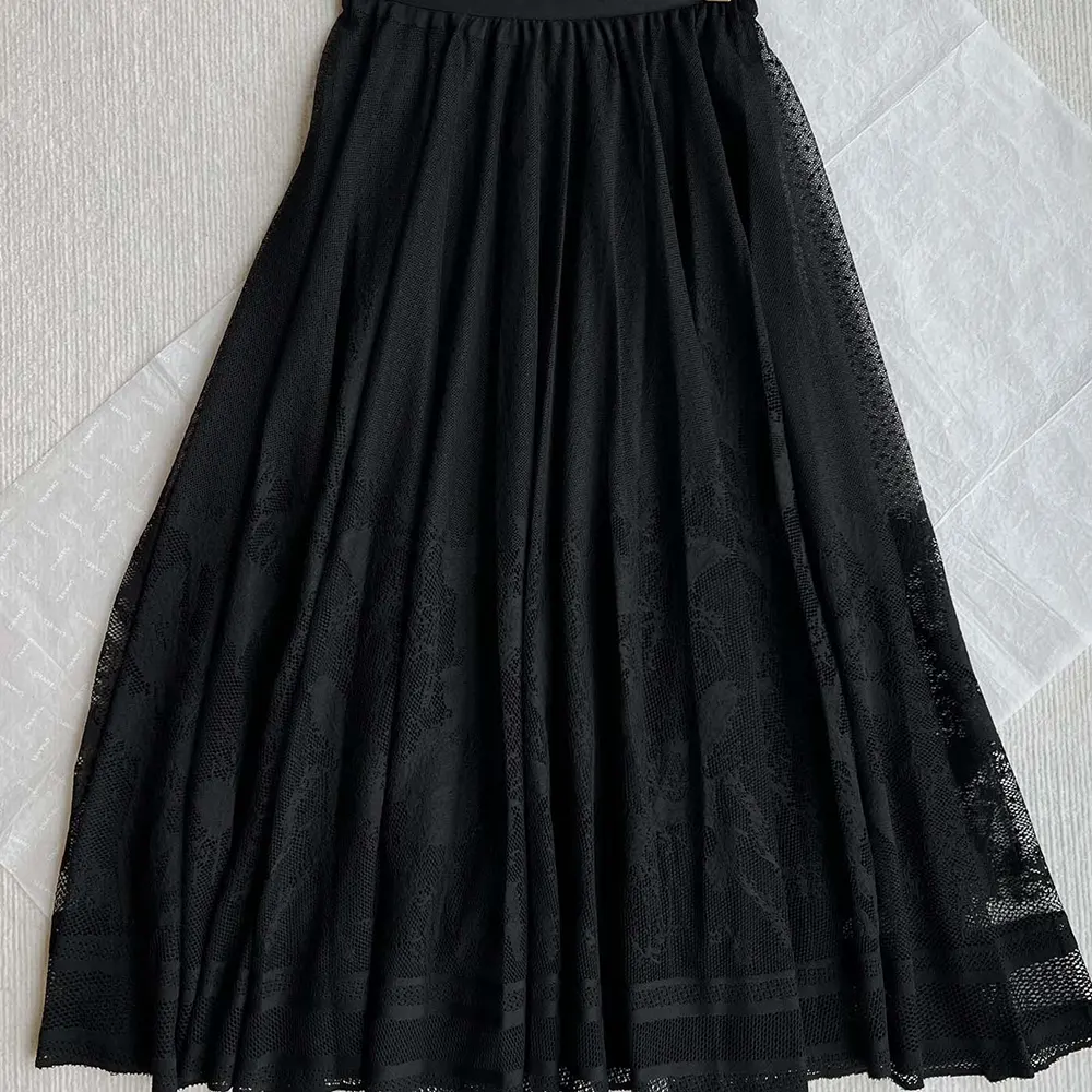 Side angle showing flare silhouette of Dior Women Flared Mid-Length Skirt Black