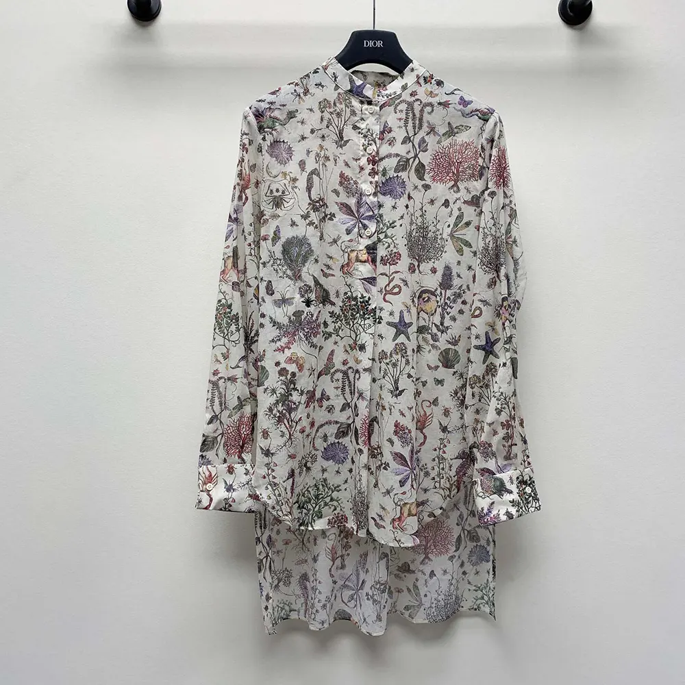 Close-up of multicolor Dior Cabinet de Curiosités motif on long blouse