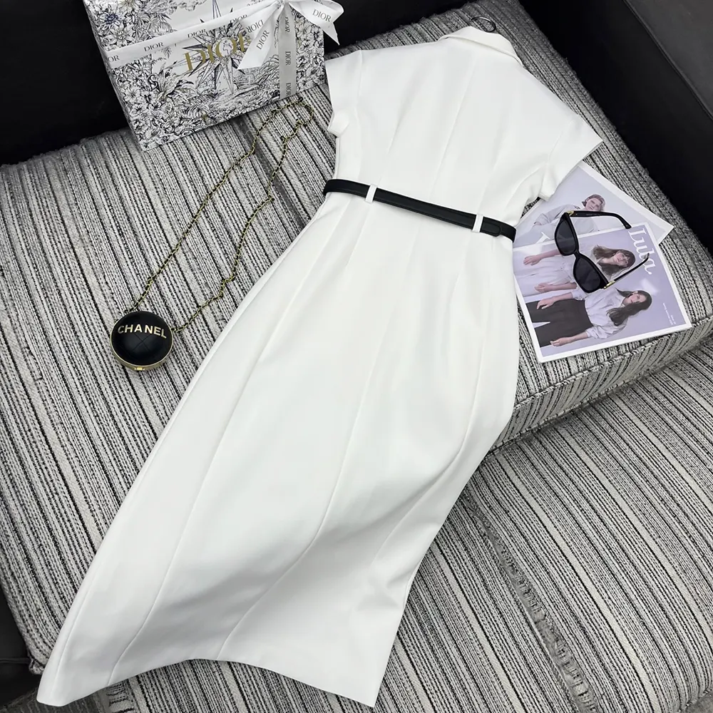 Side angle showcasing silhouette and belt detail of Dior belted dress