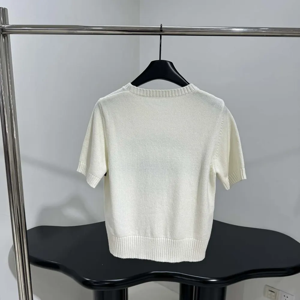 Side angle showing silhouette of Dior Women Short-Sleeved Sweater