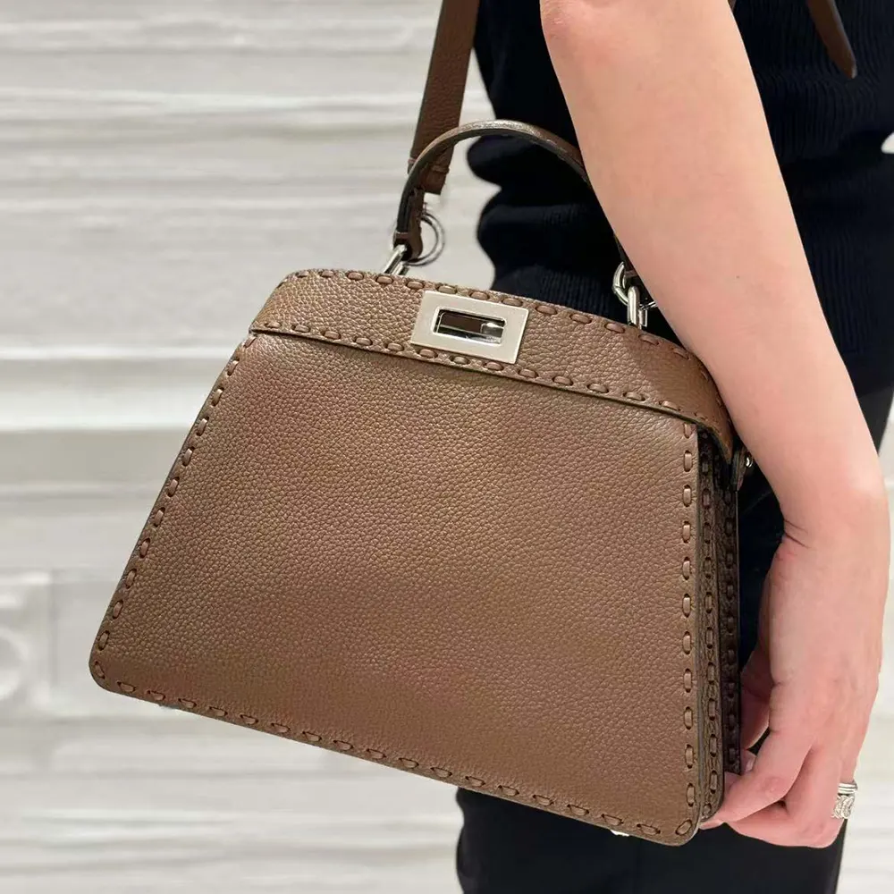 Side angle showing adjustable strap on Fendi Peekaboo Iseeu small bag