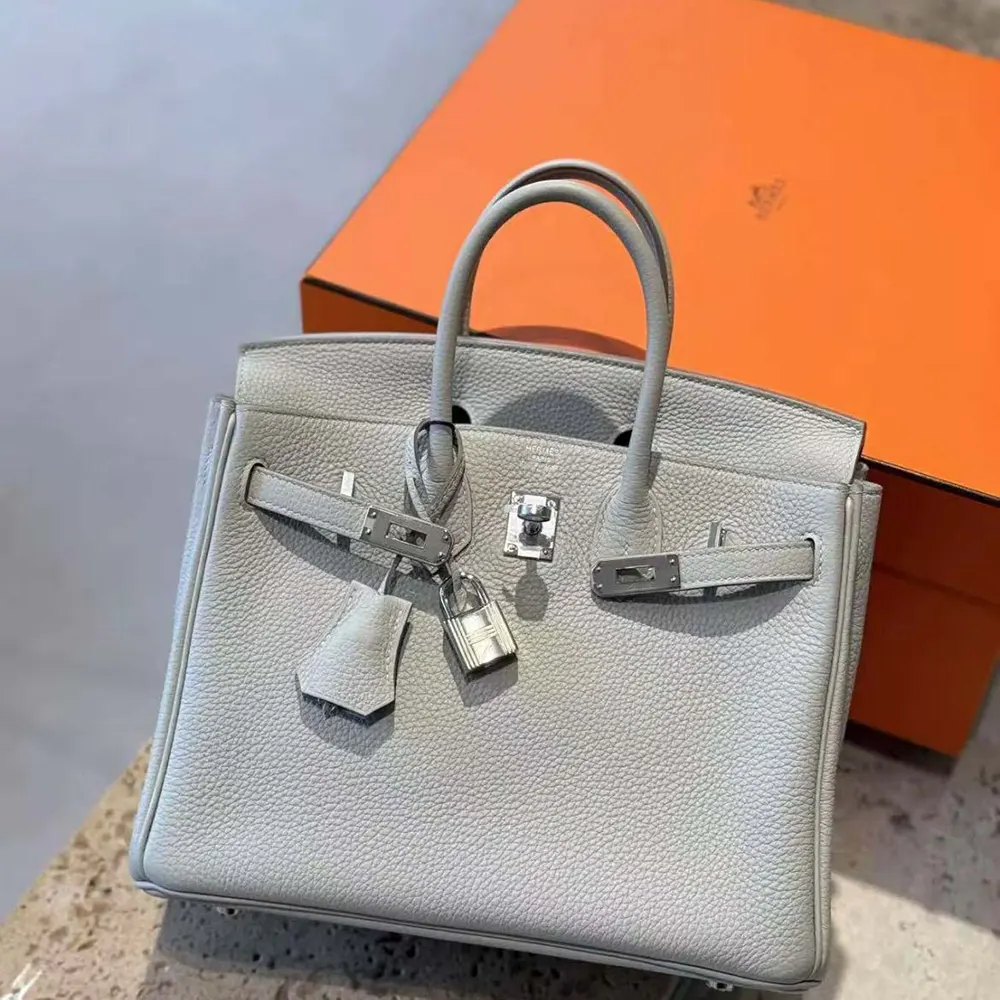 Side angle showcasing structured silhouette of Hermes Birkin 25 Bag Blue Glacier