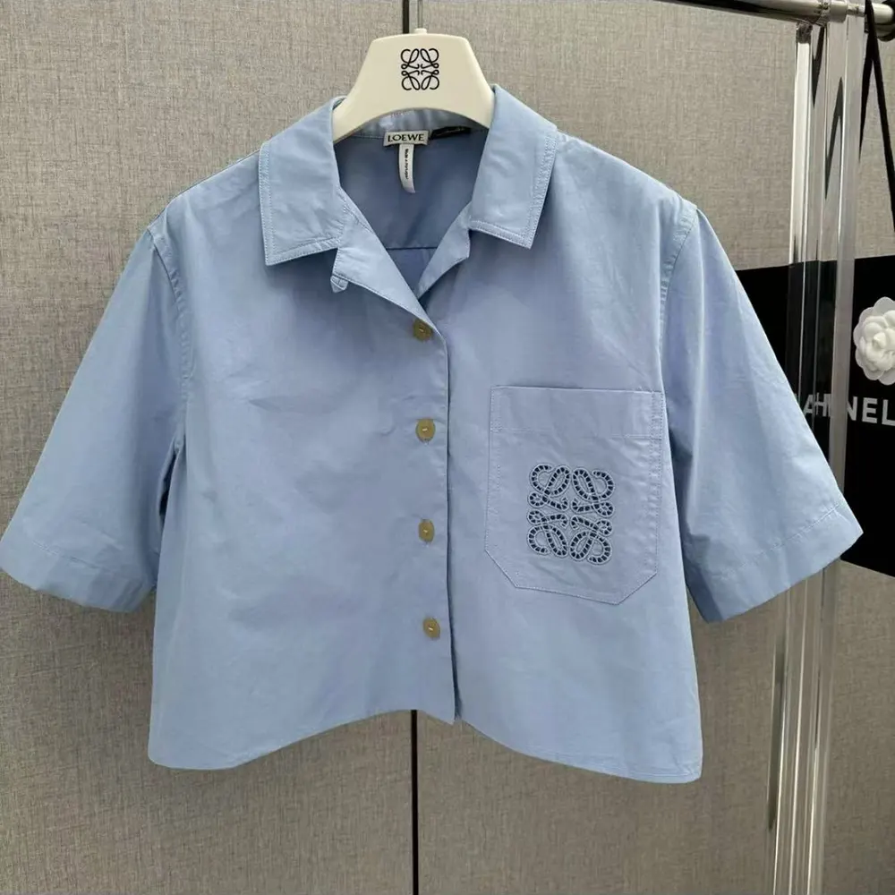 Close-up of buttons and fabric texture on Loewe Women Blue Cotton Blend Cropped Shirt