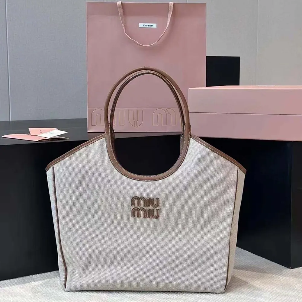 Close-up of leather trim and silver hardware on Miu Miu Women IVY Tote
