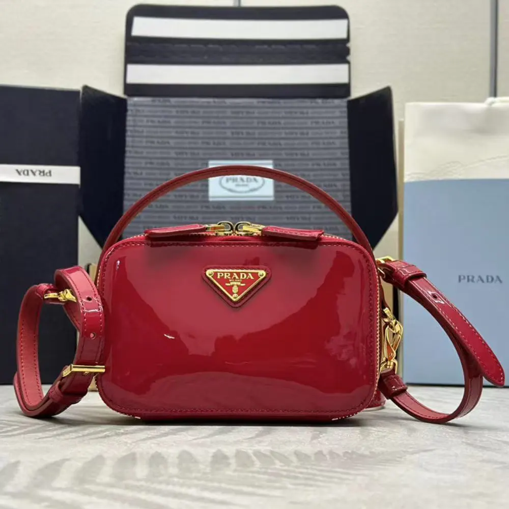 Close-up of glossy red patent leather on Prada Women Odette Mini-bag