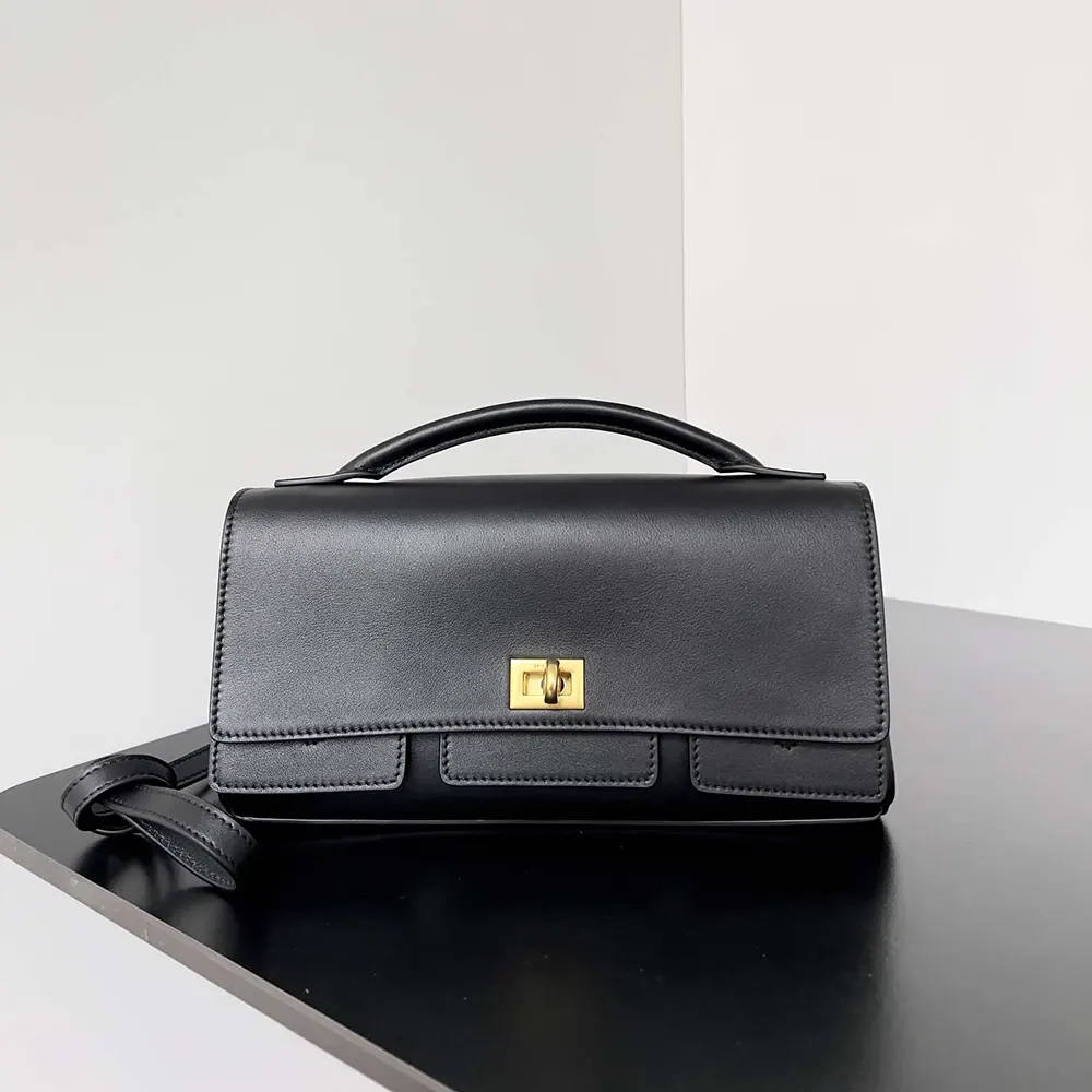 Close-up of polished silver hardware on Balenciaga Women Bel Air Clutch Small