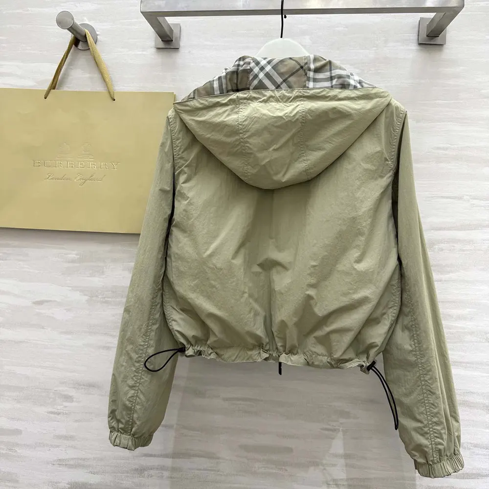 Back view showing reversible Burberry check pattern of the women's cropped jacket