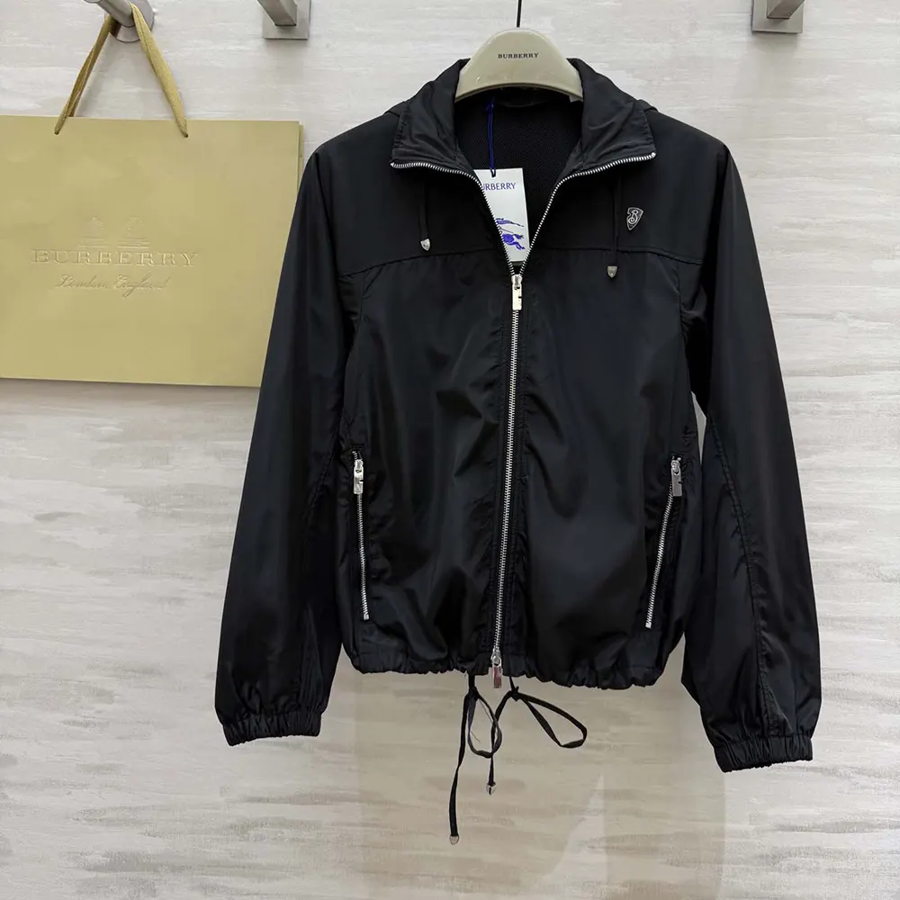 Side angle showing silhouette and adjustable cuff on Burberry Men Knight Stamp Nylon Jacket-Black