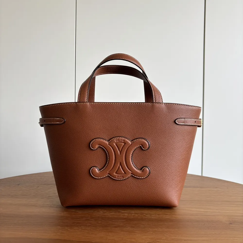 Side angle showing grained calfskin texture on Celine Unisex Mini Cabas