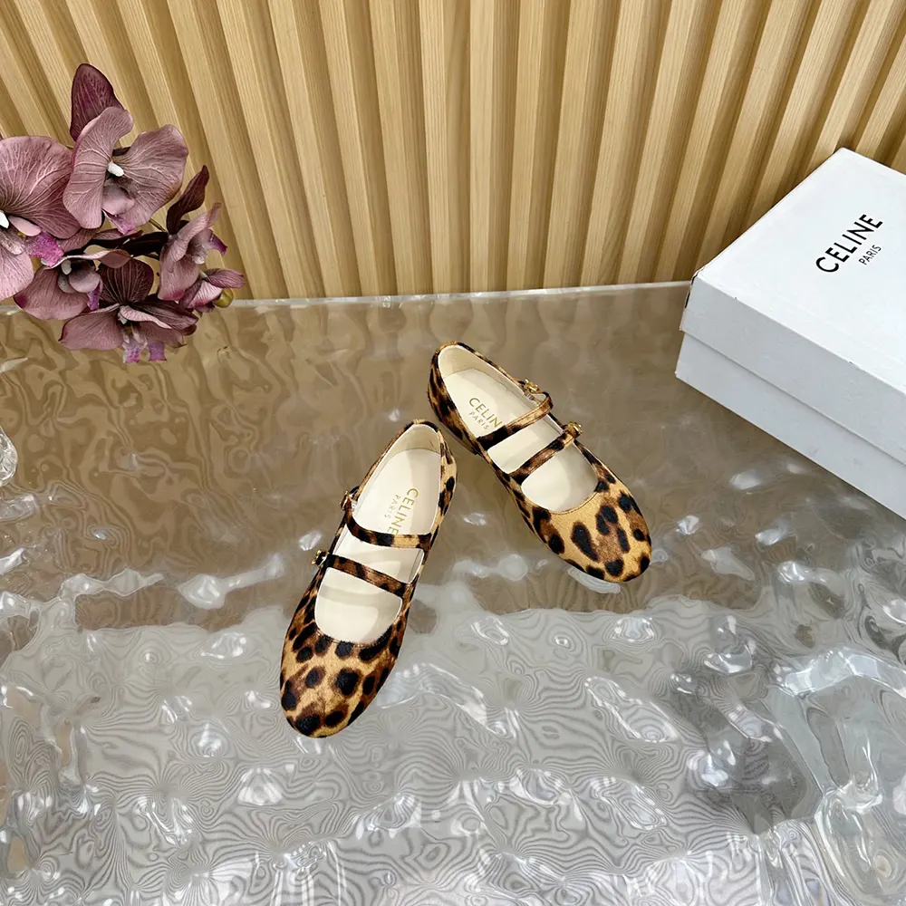 Close-up showing double strap and gold hardware on Celine leopard ballerina