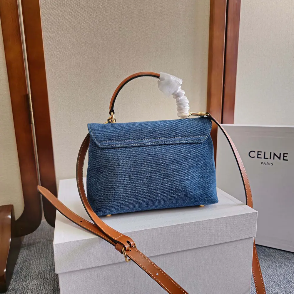 Side angle of navy denim Celine Women Teen Nino shoulder bag with strap