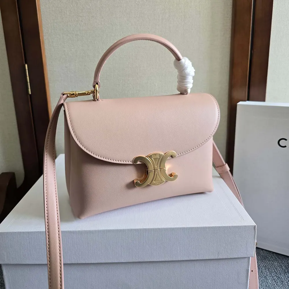 Close-up on gold-tone Celine hardware on Teen Nino Bag in pink leather