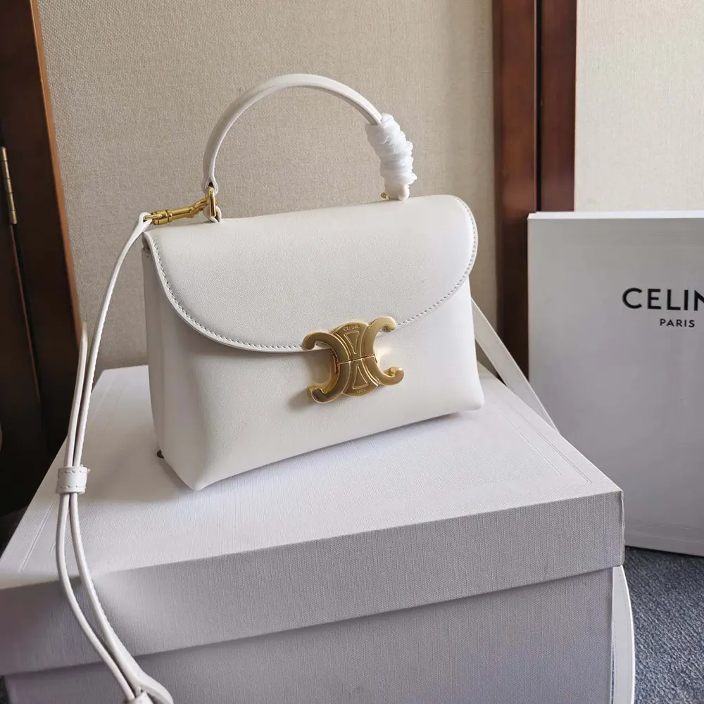 Close-up of gold-tone hardware on Celine Women Teen Nino Bag in White
