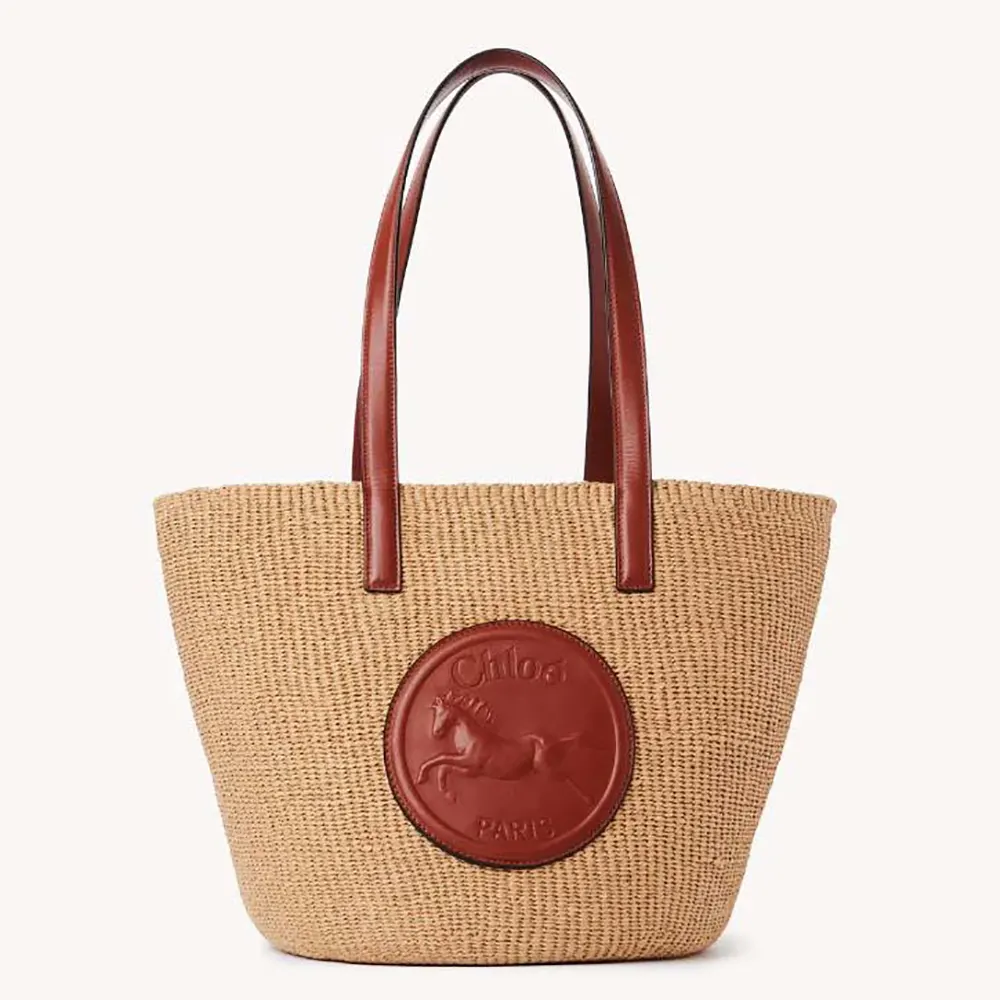 Front view of Chloe Women Large Horse Medal basket bag in brown